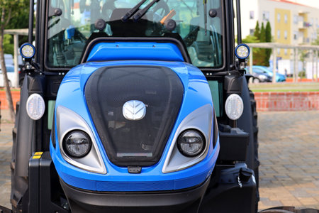 Torres Vedras, Portugal - June 27, 2023: The front of a blue New Holland tractor at an agricultural machinery show.のeditorial素材