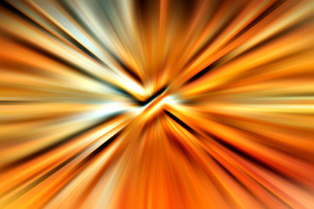 Abstract surface blur of radial zoom in orange, yellow and brown tones. Warm autumn background with radial, diverging, converging lines.の写真素材