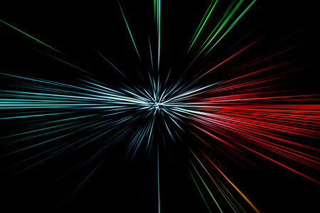 Abstract surface of blur radial zoom in blue, red and green tones on black background. Bright spectacular background with radial, diverging, converging lines.の写真素材