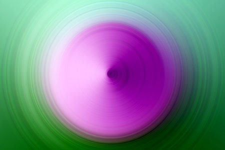 Abstract radial motion blur image featuring a vivid central gradient of magenta and violet tones transitioning into green at the edges. The spinning circular designの写真素材