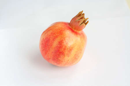 Ripe pomegranate isolated on a white backgroundの写真素材
