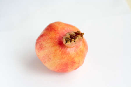 Ripe pomegranate isolated on a white backgroundの写真素材