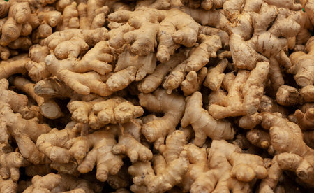 Ginger in orange, yellow and green colors are sold in the store