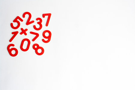 Math red numbers on a white background flat lay copy spaceの写真素材