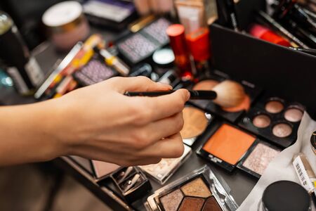 Make-up artist work in a beauty salon. Cosmetics for makeup. Makeup artist does makeup. Close-up of hands and cosmeticsの写真素材