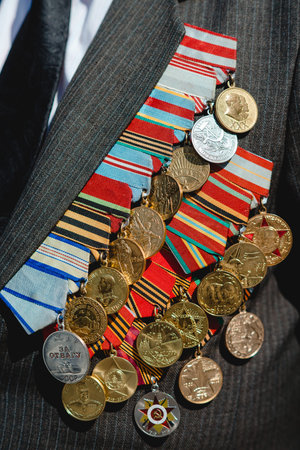 Victory Day. Orders and medals on the chest of a veteran. Close-up.