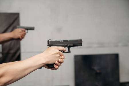 Shooting range. People shoot with gun at a shooting rangeの写真素材