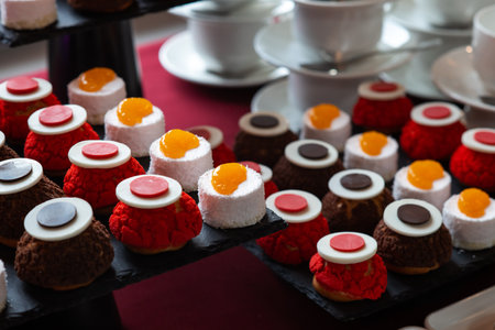 Banquet table with different snacks and dessertsの写真素材