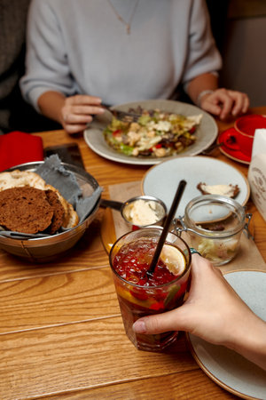 A group of friends dining with delicious foodsの写真素材