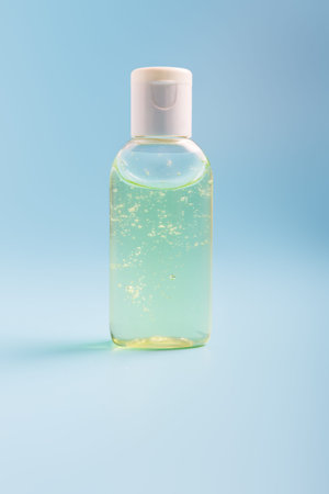 antiseptic gel on a blue background. concept of protection against virus during a pandemic and...