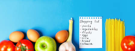 Shopping list for the supermarket. Pasta, tomatoes, eggs, garlic, bread, chicken meat, apples. Web Banner.の写真素材