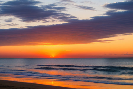 Closeup sea sand beach landscape, Orange and golden sunset sky. Generative AIの素材