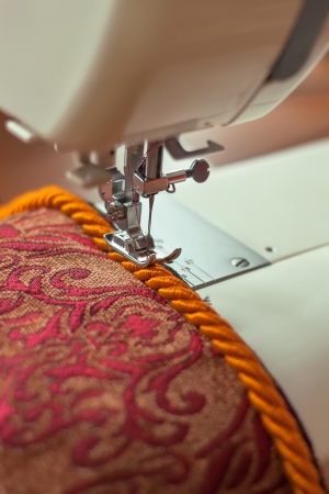 sewing machine needle and decorative edging cordの写真素材