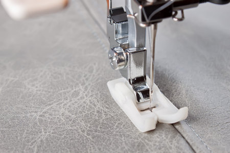 sewing machine makes a seam on leather. sewing process