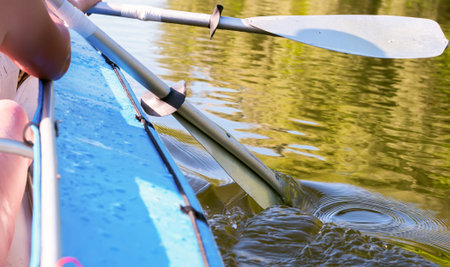 Two retro kayak paddle in the river