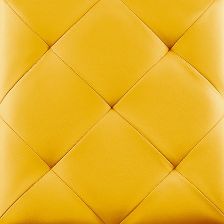 Yellow genuine leather upholstery background. Luxury pattern.の写真素材