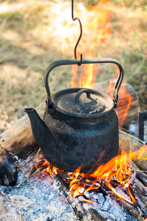 Tourist pot over camp fireの写真素材