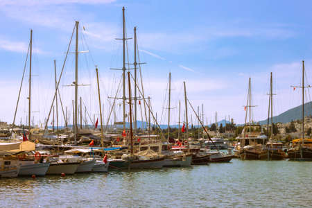 View of many yachts and boats moored at Bodrum harbor in a sunny summer day.の写真素材