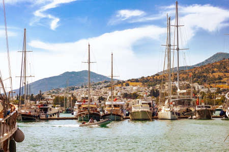 View of many yachts and boats moored at Bodrum harbor in a sunny summer day.の写真素材