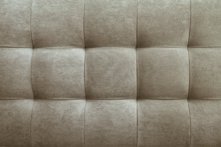 Gray suede leather background for the wall in the room. Interior design, headboards made of furniture fabric, furniture upholstery. Classic checkered pattern for furniture, wall, headboardの写真素材