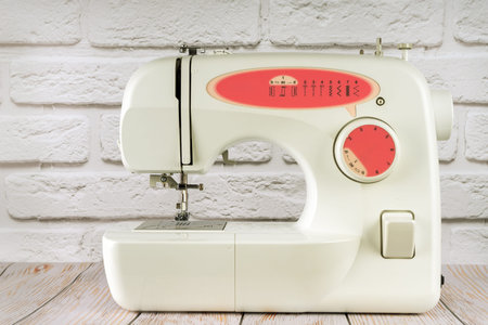 Modern multi operation sewing machine, assortment of different stitches for decorating clothes on...