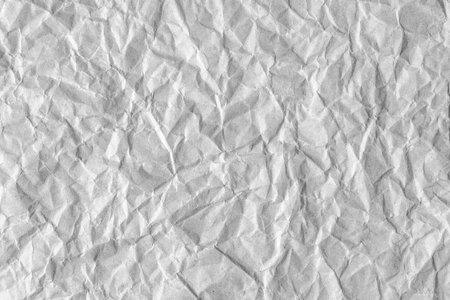 Recycled crumpled gray paper texture background. Wrinkled and creased abstract backdrop, wallpaper with copy space, top view.の写真素材