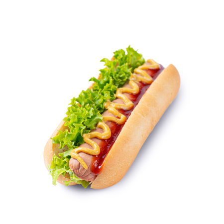 Homemade Hot Dog with yellow mustard, ketchup, tomato and fresh salad leaves isolated on white background. Fast food, street food, american cuisineの写真素材