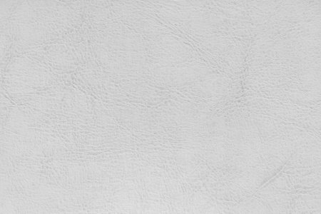 Natural, genuine white leather texture close up, macro. Structure of matte leatherette, artificial skin surface with embossing pattern. Background, wallpaper, backdropの写真素材