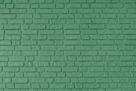 Green color painted old brick wall texture, architecture brickwork building, masonry of stone blocks...