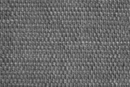 Texture of gray natural fabric with large weaving. Surface, structure of upholstery or carpet material, cloth background close up.の写真素材