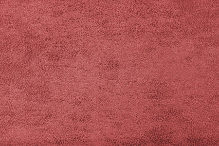 Structure of red suede fabric with abstract shabby texture with embossed shades closeup, macro. Upholstery, decorative cloth structure, canvas for home decor. Background, backdrop, wallpaper.の写真素材