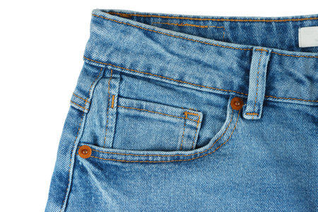 Front side of blue jeans pants. Design details, cloth tag, waistband, pocket and small pocket close up, macro isolated on white background. Fashion concept, casual wear, business, shopping, saleの写真素材