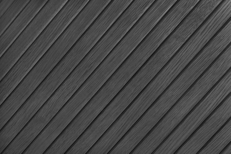 Wooden diagonal plank, bamboo surface texture, board wall background. Painted wooden panels black color, wallpaper, backdrop, design element.の写真素材