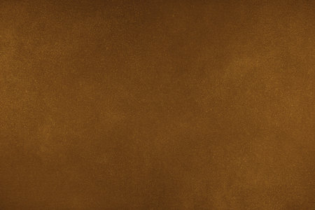 Abstract grungy texture background with different shades of dark matte orange color. Painted canvas, concrete surface, studio backdrop, grainy textured effectの写真素材