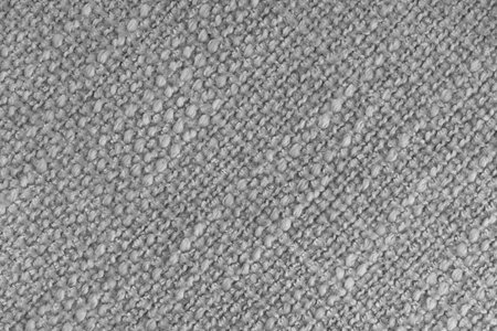 Close up, macro of gray woven fabric with detailed texture and diagonal pattern. Textile, cloth, material, fashion, upholstery, or abstract design background.の写真素材