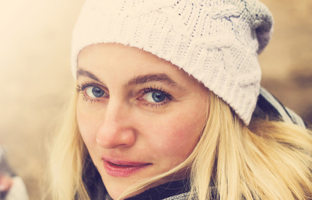 Portrait of a beautiful sad girl in a hat. Tonedの写真素材