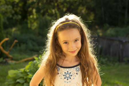 Happy little girl having fun at the parkの写真素材