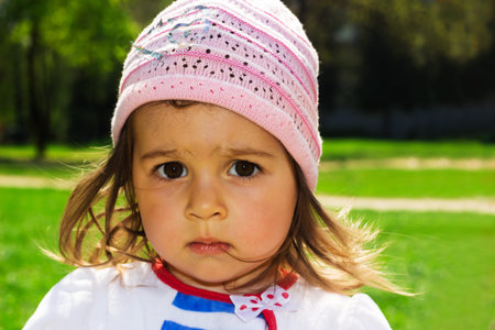 Cute kid thinking at the park