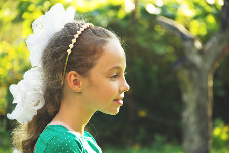 Thinking about - portrait of beautiful pondering little girl - at the summmer sunsetの写真素材