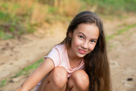Happy Little girl excited. Cute teen Girl smiling very happy on Summer background. の写真素材