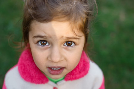 Portrait of Sad cute little girl looking sad and afraid