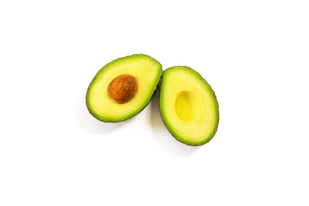 Avocado halves on a white background for healthy nutrition, isolated on white