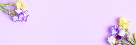 Flower Banner on lilac background of iris flowers. Happy Mothers Day greeting card, happy Valentines Day, March 8, happy birthdayの写真素材