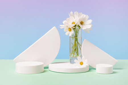 Concept scene stage showcase for new product, banner, promotion sale, cosmetic, presentation. White round podium and white cosmea flowers on blue background.の写真素材