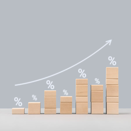 Wooden blocks with arrow up and growth of bar chart percentage sign, inflation, profit, long term investment, financial growth. Stock market chart for bank. Interest rate finance and mortgage rates.の写真素材