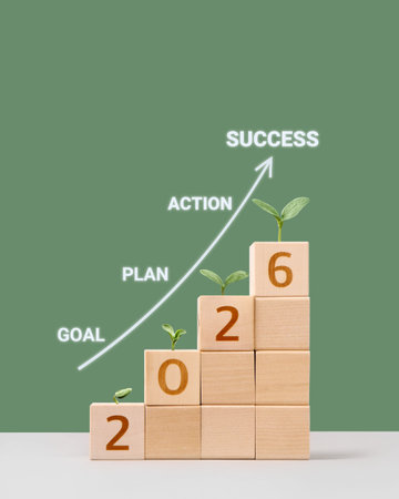 Wooden cubes with numbers 2026 and young green seedling are a symbol of success. Development to success, planning and motivation in 2026, challenge and business strategy in new year, business progressの写真素材