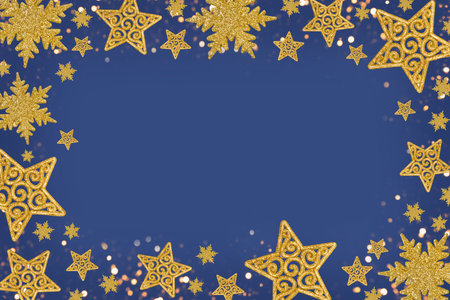 Christmas blue background with Christmas tree decorations with a golden snowflake and star. New Year...