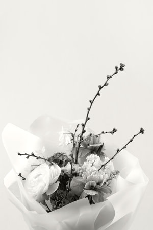 Demonstrating the colors of 2026 - Cloud Dancer. Bouquet of daffodils, hyacinths, roses, ranunculus, tulips, lilac and a branch of prunus.の写真素材