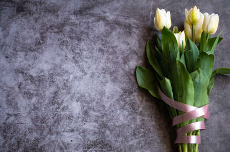 Flatlay of tulips on the black background.の写真素材