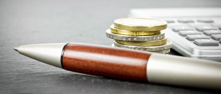 Coins and calculatorの写真素材